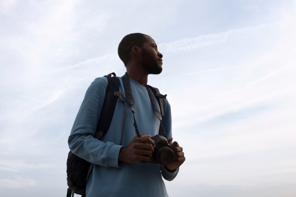 A man examining all the signs around him.