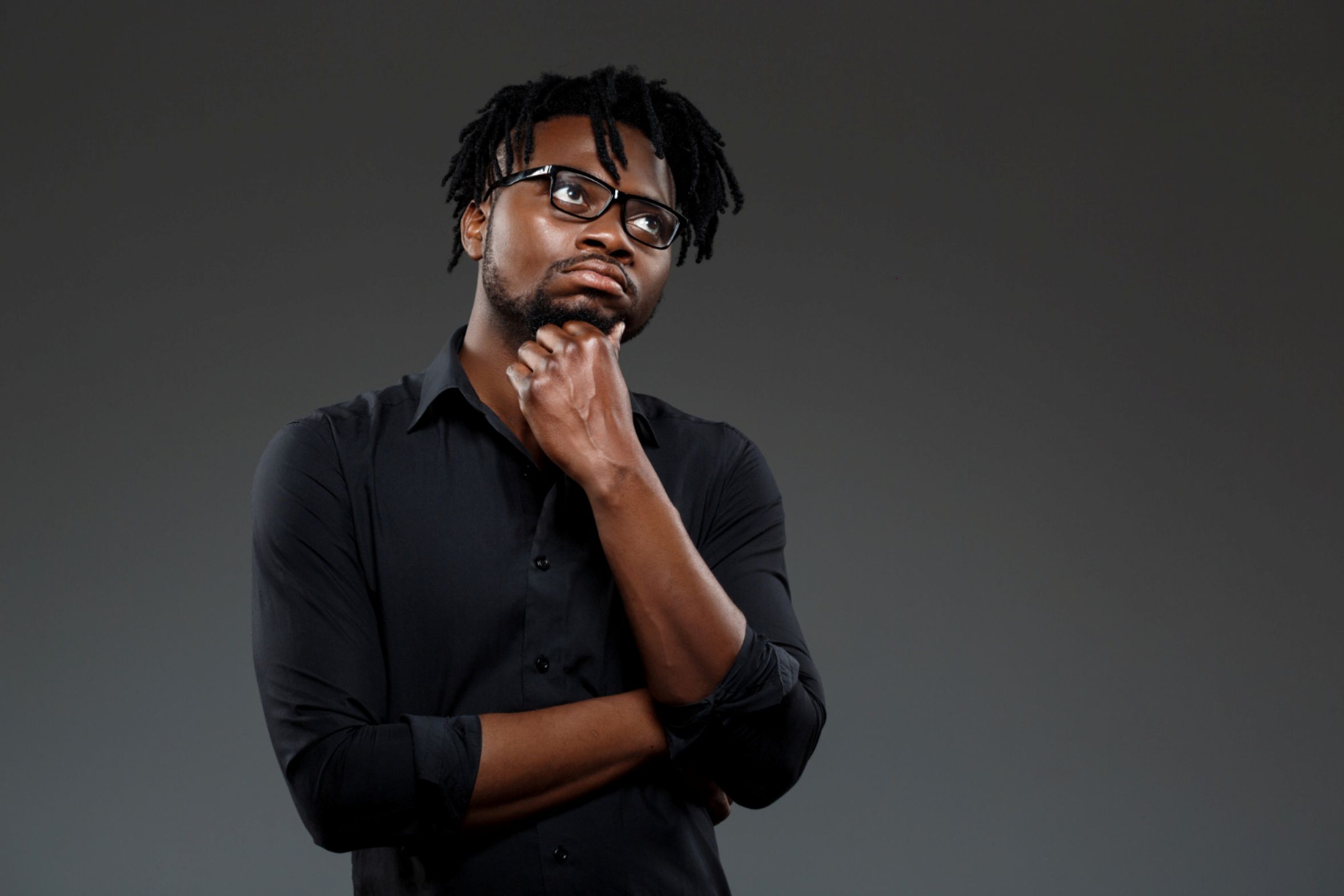 A man thinking about how to slow down his writing.