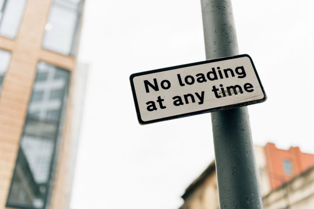 A sign that says “No loading at any time.”